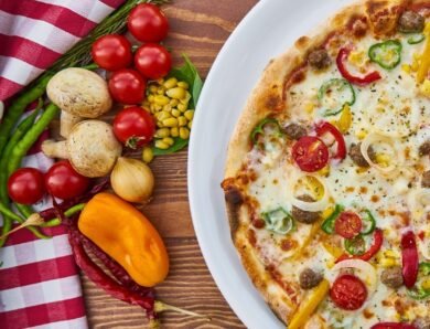 Cheesy pizza with tomatoes, cherry at top