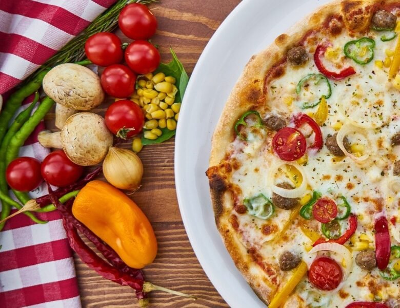 Cheesy pizza with tomatoes, cherry at top